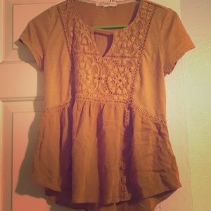 I’m selling an XS orange blouse